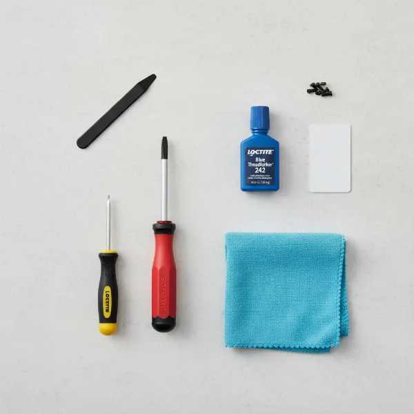 Essential tools for smart lock repair including screwdriver, threadlocker, cloth.